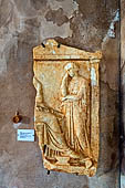 Hania - the Archaeological Museum, Fragment of Funerary relief, before the seated dead woman stands another young (4th c. BC) found at Khania, 1963.